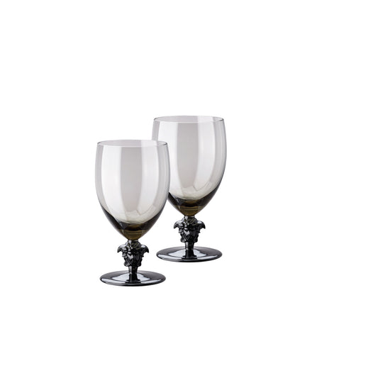 A set of two round red wine glasses with a clear glass body and black ornate bases.