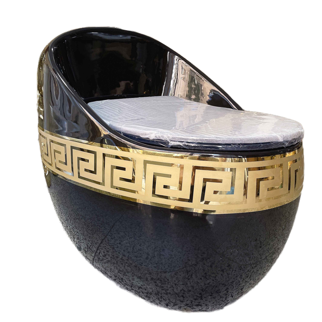 A black and gold ceramic toilet with a geometric Greek key design around the bowl.