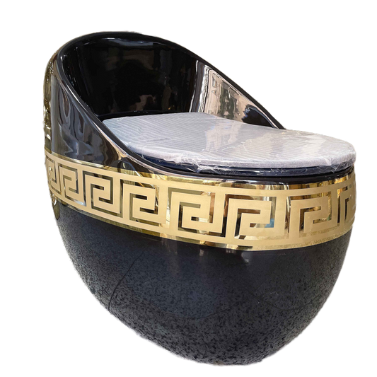 A black and gold ceramic toilet with a geometric Greek key design around the bowl.