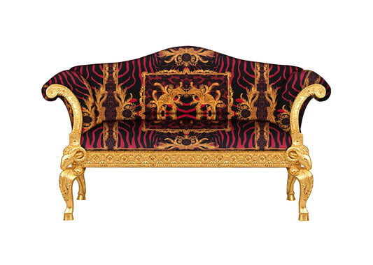 An image depicting a luxurious Versace Zahara leopard fabric love seat sofa with a solid wood frame and gold leaf finish, featuring intricate ram's head carvings.